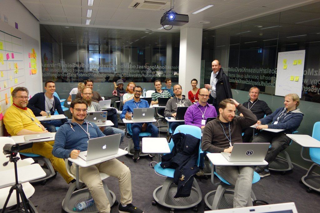 All together Here in the picture, the participants are sitting all together while the even is kicked-off.